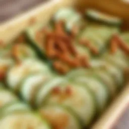 Sliced zucchini arranged in a baking dish with herbs and spices